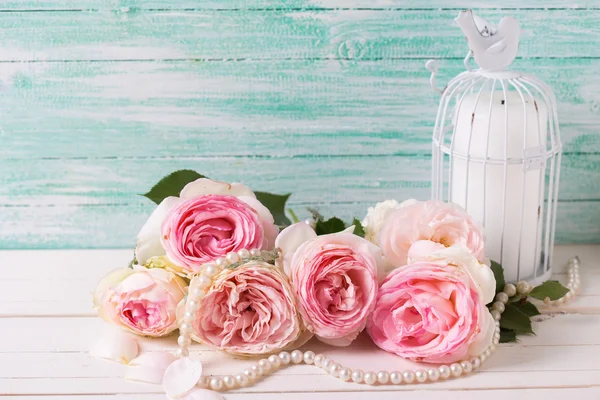 Roses flowers, pearl and candle — Stock Photo, Image