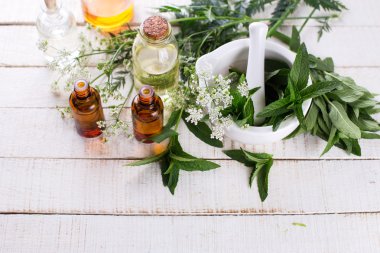 Bottles with essential aroma oil with mint  