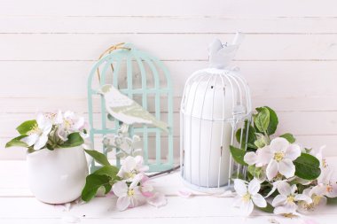 apple blossom and candle in decorative cages