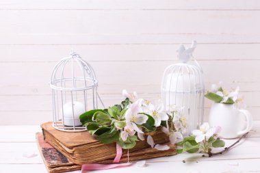 Apple blossom, old book and candles