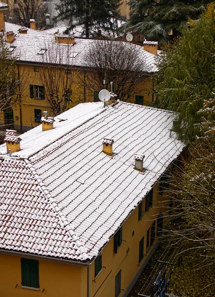 Houses in Bologna with fresh snow on the roofs. Italy