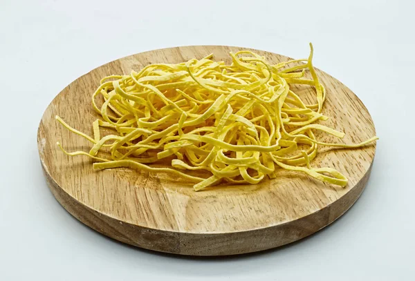 Uncooked Tagliolini Pasta Fresh Pasta Wooden Bowl Isolated White Background — Stock Photo, Image
