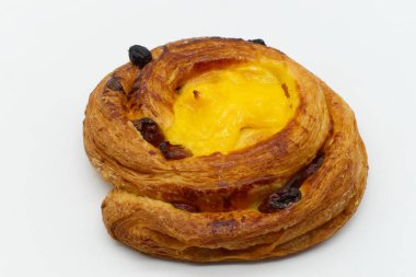 A raisins cream brioche isolated on white background.