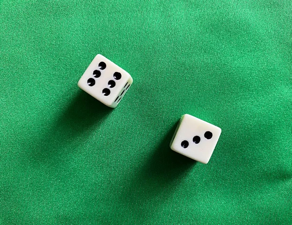 Dices on green table. Game of chance concept.