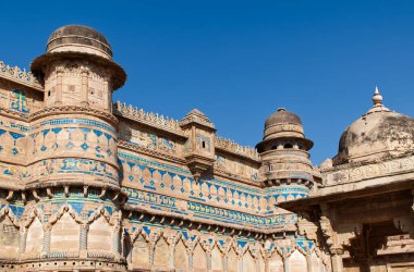The historic Gwalior fort, featuring ancient architecture and intricate blue tile work. Gwalior Qila, Madhya Pradesh, India.