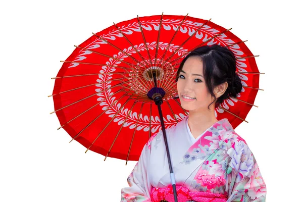 Geïsoleerde jonge Japanse vrouw met een rode paraplu — Stockfoto