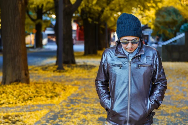 An asain man in a brown jacket — Stock Photo, Image