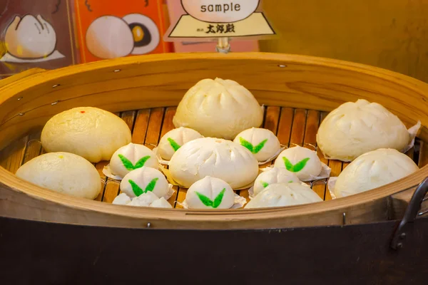 Chinese steamed buns in a steamed basket