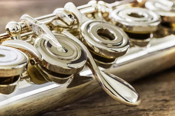 Modern Concert Flute on a Wood Table — Stock Photo, Image