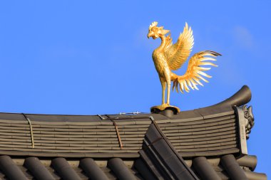 Phoenix Ornamaent on the Roof of Byodo-in Temple in Kyoto, Japan clipart