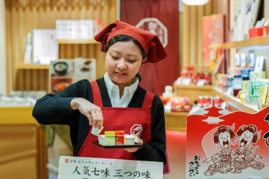 Japanese shop keeper at Nishiki Market in Kyoto clipart