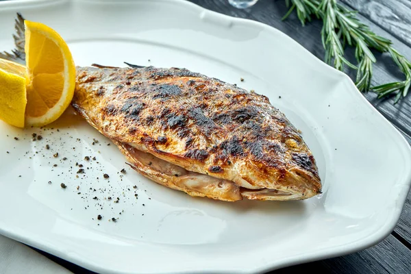 Appetizing Grilled Dorado Charcoal Lemon Served White Plate Dark Wood — Stock Photo, Image