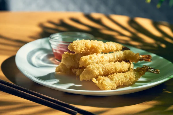 Deep-fried king prawns in tempura with sauce. Chinese cuisine.