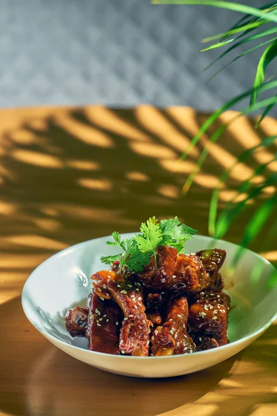 Pork Ribs Sweet Sour Sauce Cilantro Sesame Seeds Sichuan Pepper — Stock Photo, Image