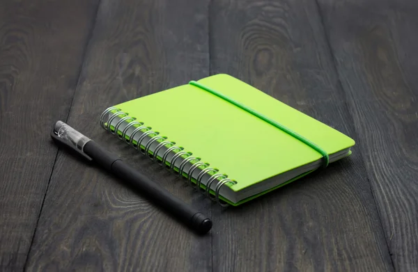 Black pen and notebook — Stock Photo, Image