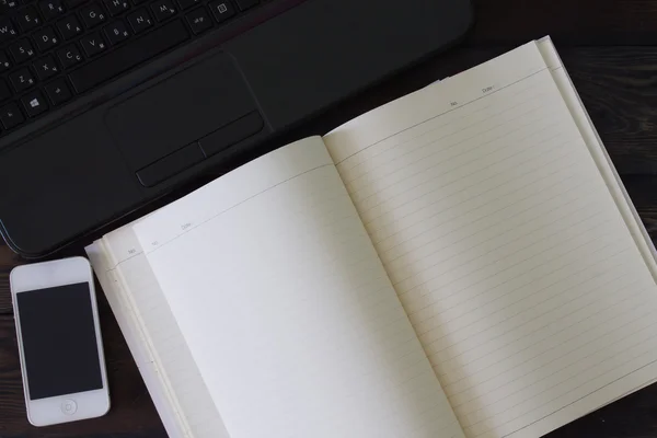 Phone laptop and notebook on the desktop — Stock Photo, Image