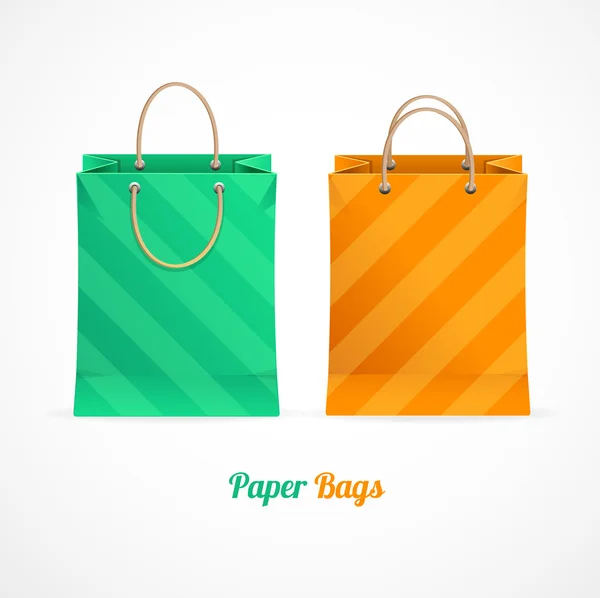 Vector groen en oranje papier shopping tassen — Stockvector