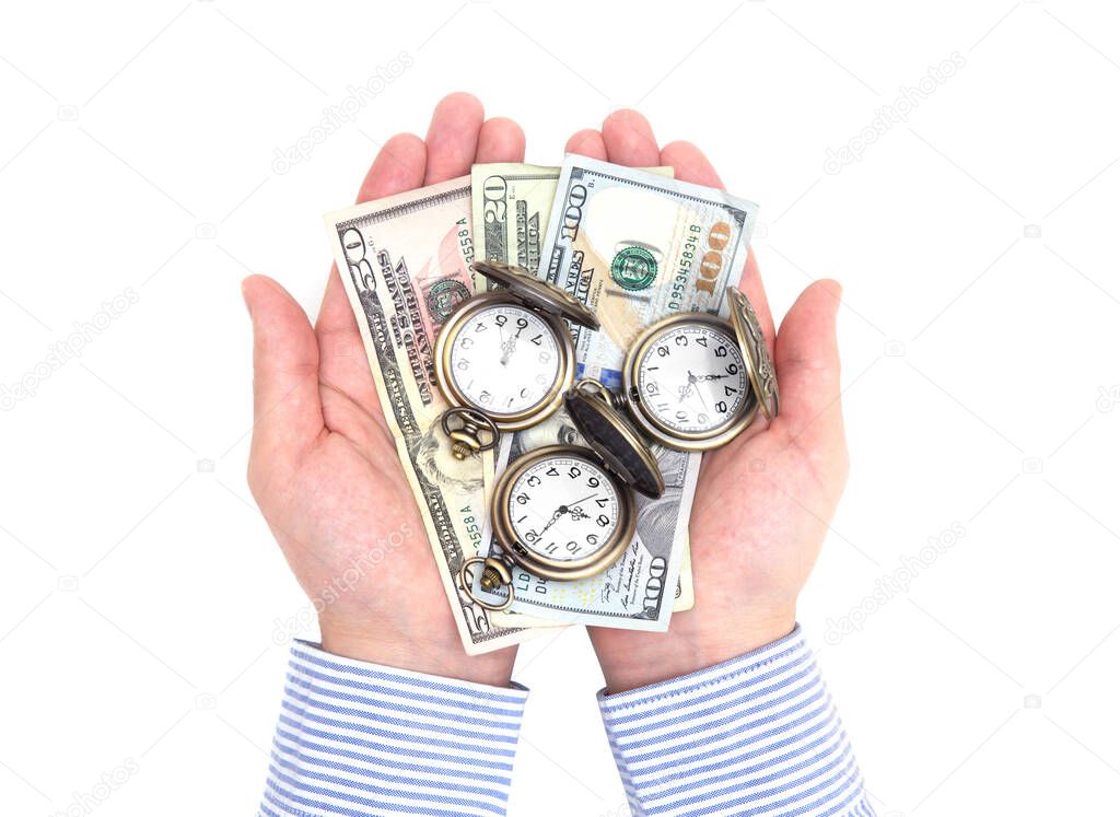 Top view of male hands holding three antique pocket watches and dollar bills isolated on white. Creative time investment concept.