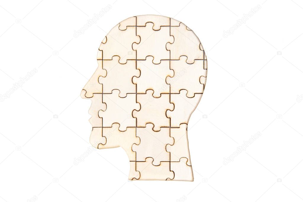 Silhouette of a man's head made from wooden puzzle pieces isolated on white