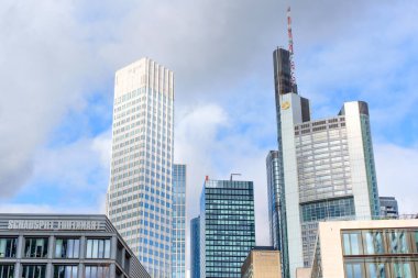 Frankfurt, Germany - October 21, 2025: Iconic Frankfurt skyline, featuring Commerzbank Tower and contemporary architecture, under a dramatic sky. Germany's financial hub.