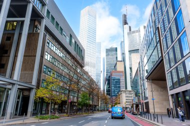 Frankfurt, Germany - October 21, 2025: Vibrant street view showcasing Frankfurt's skyline with modern architecture and clear skies.