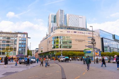 Frankfurt, Germany - October 21, 2025: Frankfurt's vibrant city center showcases the prominent Galeria Kaufhof department store and surrounding modern architecture with pedestrians and vehicles.