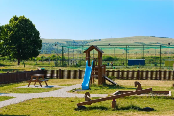 Playground for the kids in a large open space Stock Image