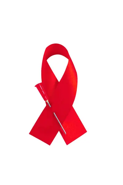 Světový den AIDS. Izolovaný symbol červené stuhy. — Stock fotografie