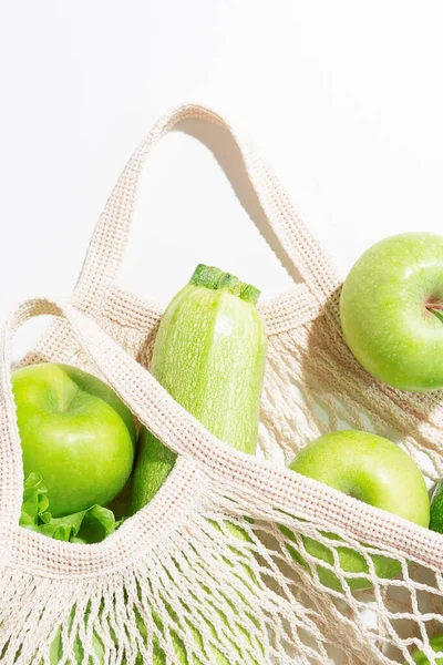 Close-up fresh green food in string bag. — Stock Photo, Image