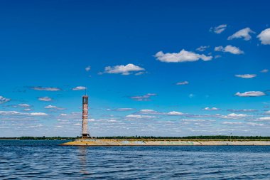 The view on the lighthouse and cloudy sky