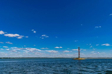 The view on the lighthouse and cloudy sky