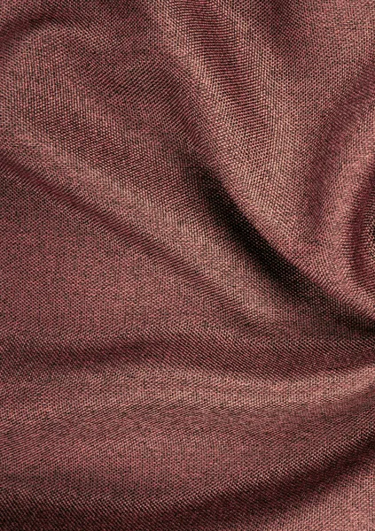 a fragment of blackout curtain fabric. texture, color unsaturated red