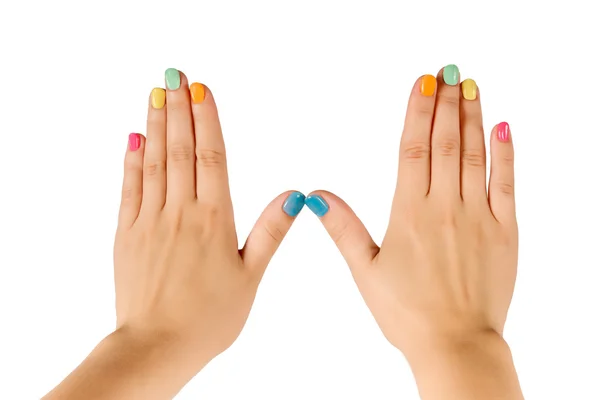 Manos femeninas con manicura colorida —  Fotos de Stock