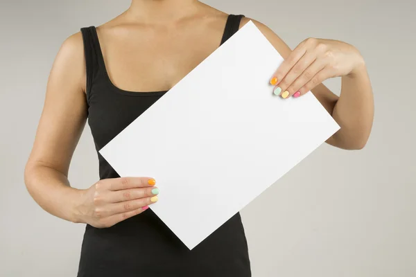 Young woman with empty sheet of paper — Stock Photo, Image