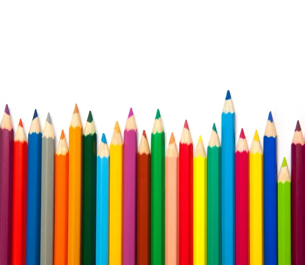 Lápis multicoloridos em branco — Fotografia de Stock