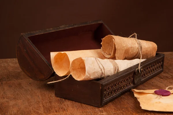 Chest with old documents on table — Stock Photo, Image