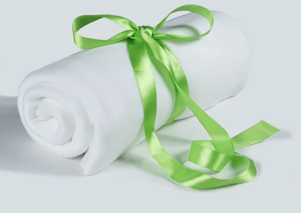 Twisted towel tied with a ribbon — Stock Photo, Image