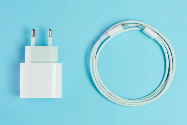 A white smart phone charger cable with lightning hi speed USB A connector and adapter. — Stock Photo, Image