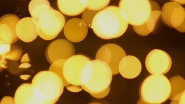 Abstract beweging achtergrond van gouden glitter bokeh van lichten. Kerst achtergrond — Stockvideo