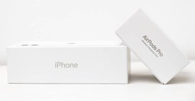 iPhone and AirPods Pro boxes isolated on the white background. Unboxing process. Shopping concept. December 2020, San Francisco, USA