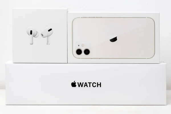 Airpods pro, iPhone 11, Apple watch boxes isolated on the white background, December 2020, San Francisco, USA — Foto Stock