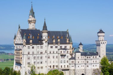 Closeup Neuschwanstein castle on a hill in summer near Schwanstein, Bavaria, Germany, April 2020
