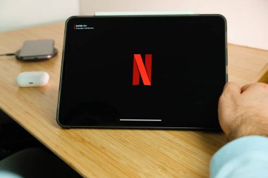 Netflix logo on the screen of iPad tablet. March 2021, San Francisco, USA