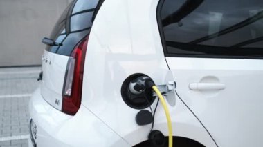 Electric car EV charging in the street. 