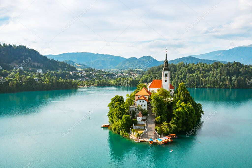 Aerial view of lake Bled with assumption of Mary Pilgrimage Church on the small island on the background of Julian Alps in Slovenia 