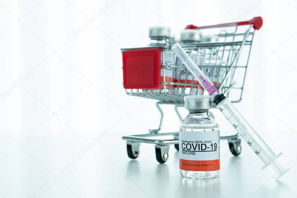 Coronavirus 2019-nCoV or COVID-19 vaccine doses in a shopping cart with copyspace, an emergency and urgent COVID19 vaccine distribution. COVID-19 protection.