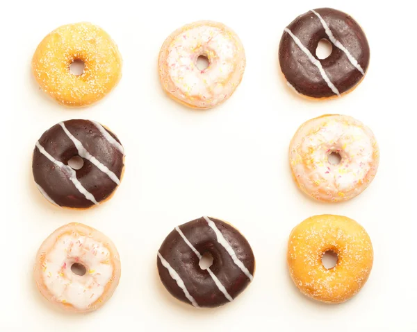 Muster Rand aus verschiedenen Donuts — Stock Photo, Image