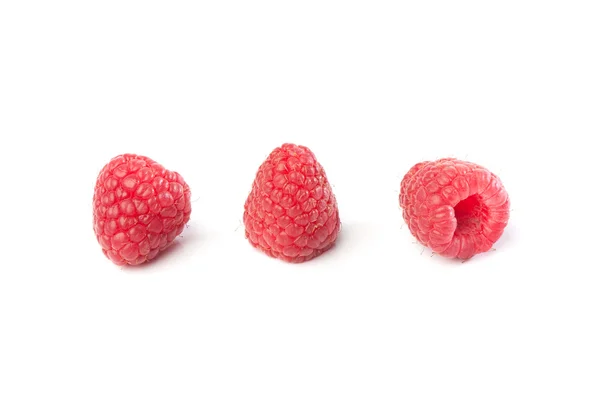 Tři rasberries na bílém pozadí — Stock fotografie