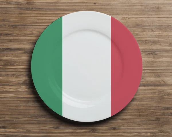 Plate on table with Italy flag — Stock Photo, Image