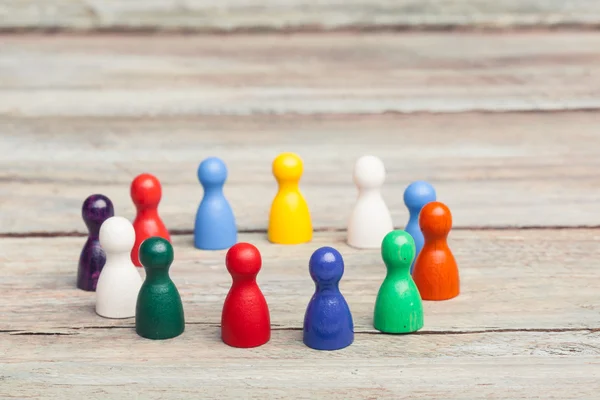 Circle of colored pawns, teamwork — Stock Photo, Image